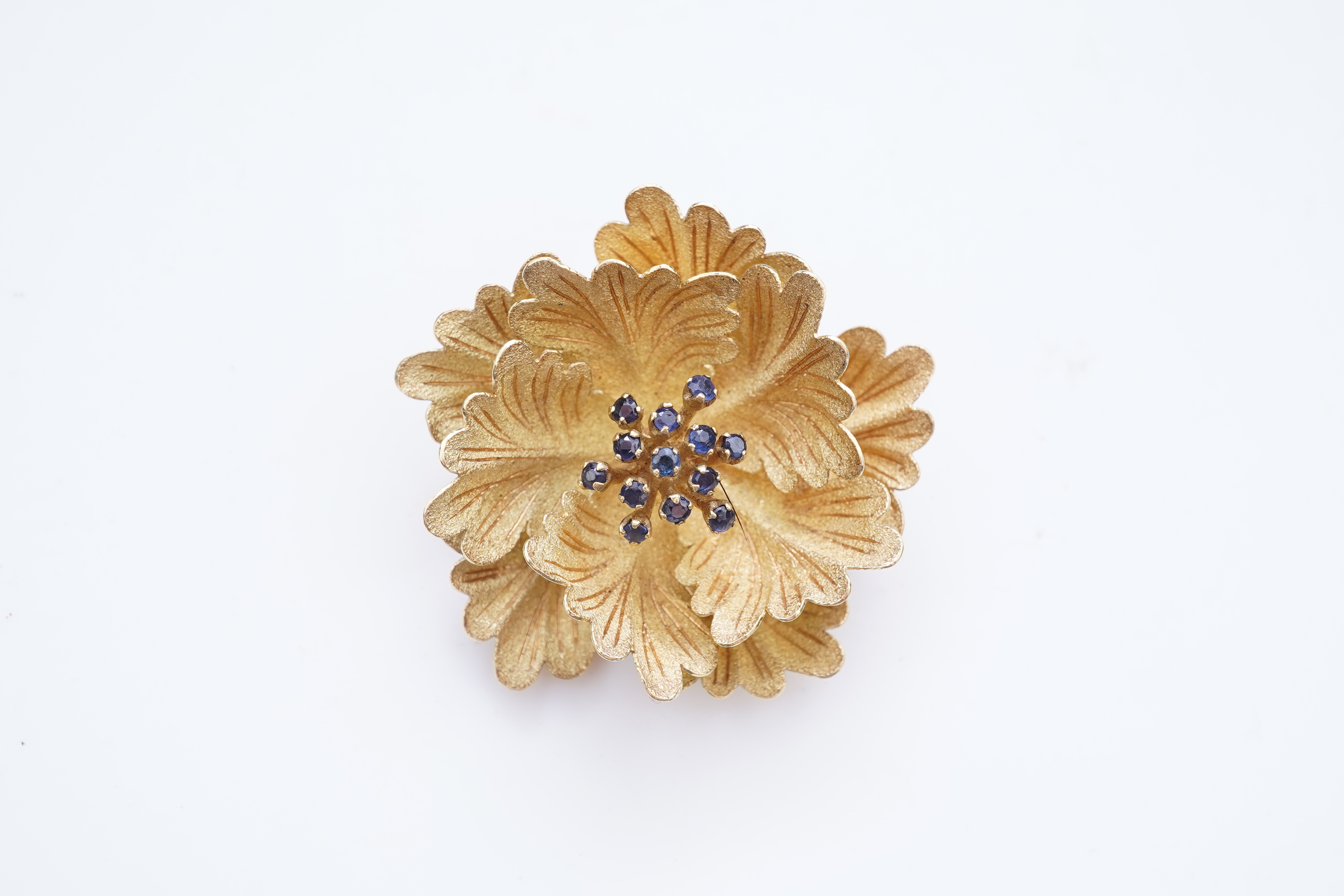 A gold and sapphire brooch, third quarter 20th century